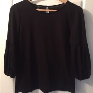 Talbots black top with peasant style sleeves.